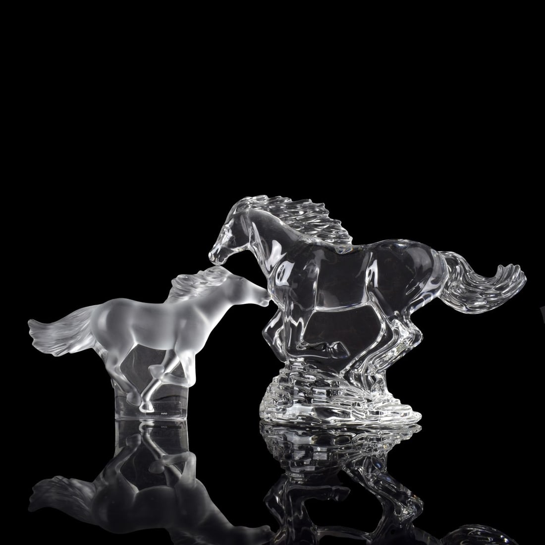 Lalique and Waterford Horse Figures: Lalique and Waterford Horse Figures. One Lalique galloping horse in clear and frosted crystal and one (1) Waterford galloping horse in polished clear crystal. Each properly marked to the bottom. Water