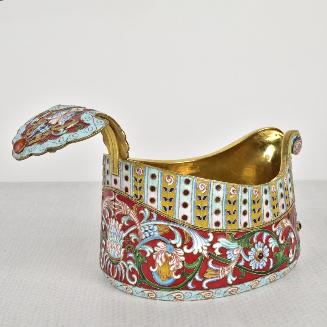 Russian Silver-Gilt and Cloisonne Enamel Kovsh Cup: 20th Century Russian Kovsh Cup. Stamped with the mark of Carl Faberge and 88. Featuring fine cloisonne enamel decoration in traditional floral patterns. Measures: 3-1/8" H, 6" W, 3" D. Total approxima