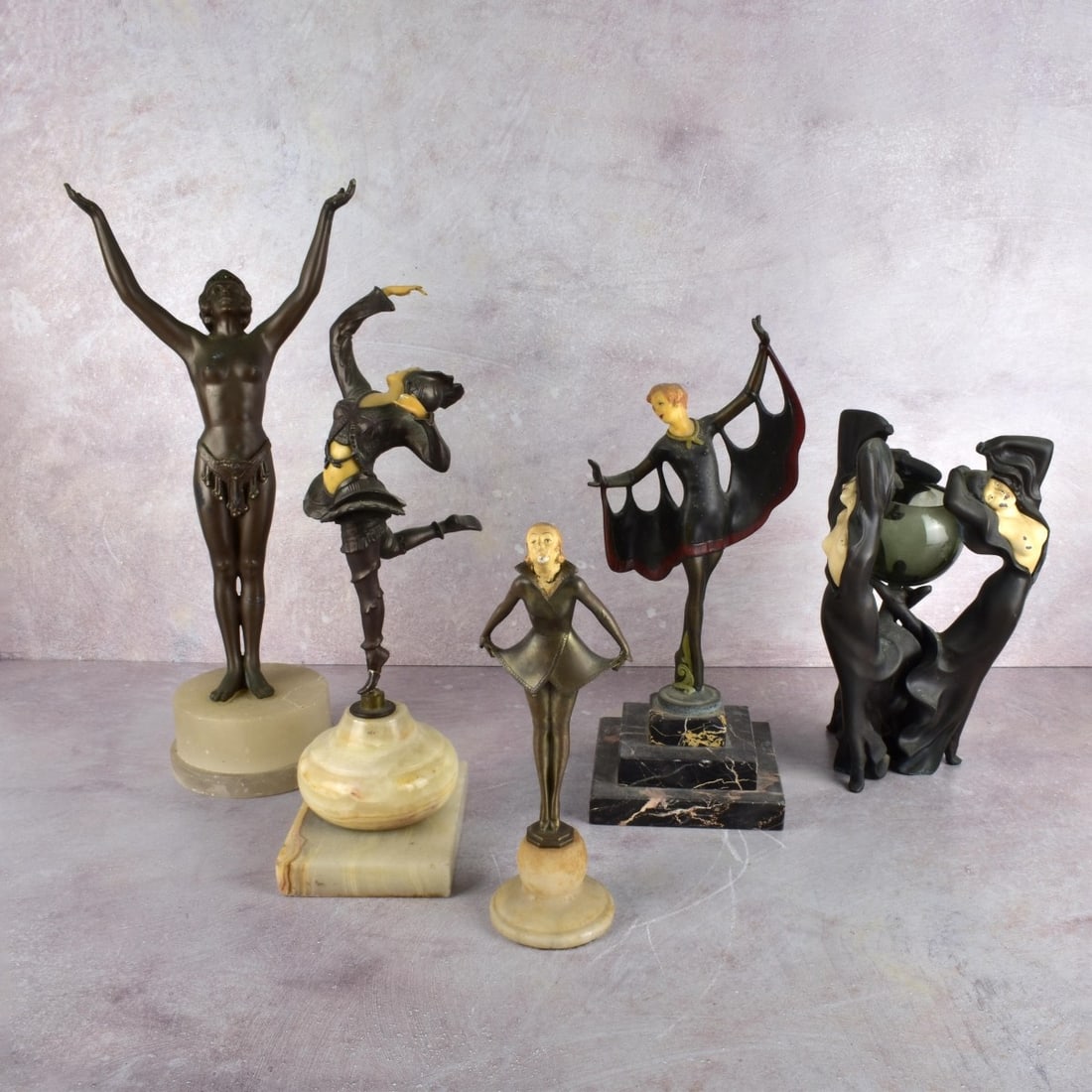 Collection of Art Deco Figurines: Collection of Art Deco Metal Brass or Bronze Figurines with painted or plastic heads, some on marble bases. A dancing lady, a curtsying lady, a lady with cape marked "Collection Francaise Made in USA"