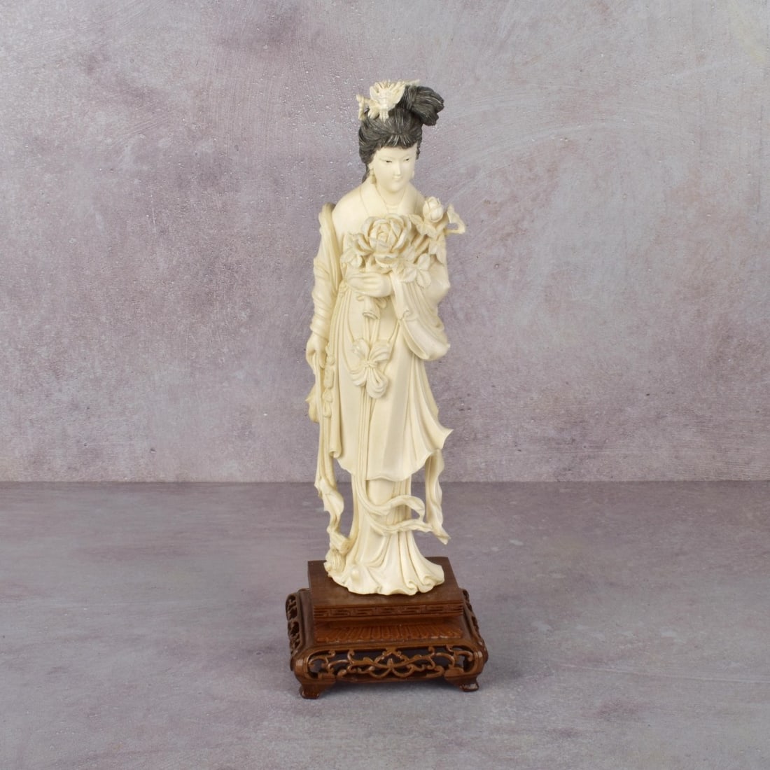 Antique Carved Japanese Figure of a Lady: Antique Carved Japanese Figure of a Lady of the Court with Flower Bouquets on a Reticulated Carved Wood Base. Figure measures: 9-5/8 " H, base measure: 2" H, 3-3/4" W, 3-3/4" D. We Will Not Ship This 