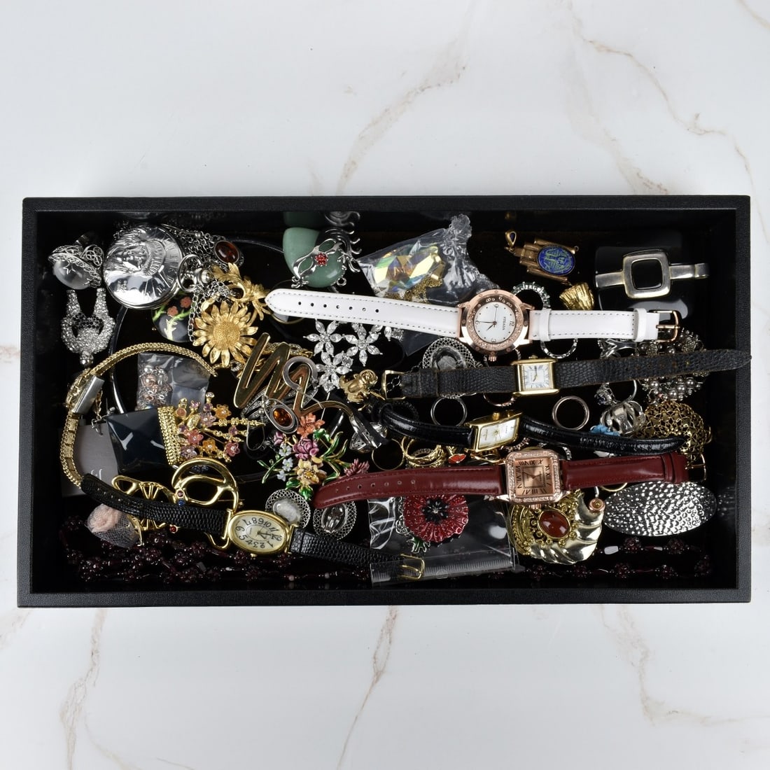 Box Lot of Fashion Jewelry: Box Lot of Fashion Jewelry. Large assortment of bracelets, necklaces, watches, earrings and brooches. Condition: Good condition. Please note the gallery does not warranty the running condition of watc