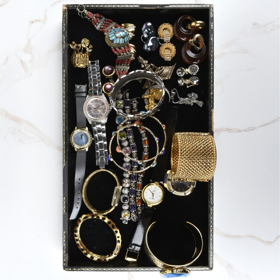 Box Lot of Fashion Jewelry: Box Lot of Fashion Jewelry. Large assortment of bracelets, necklaces, watches, earrings, watches and brooches. Condition: Good condition. The gallery does not warranty the running condition of watches