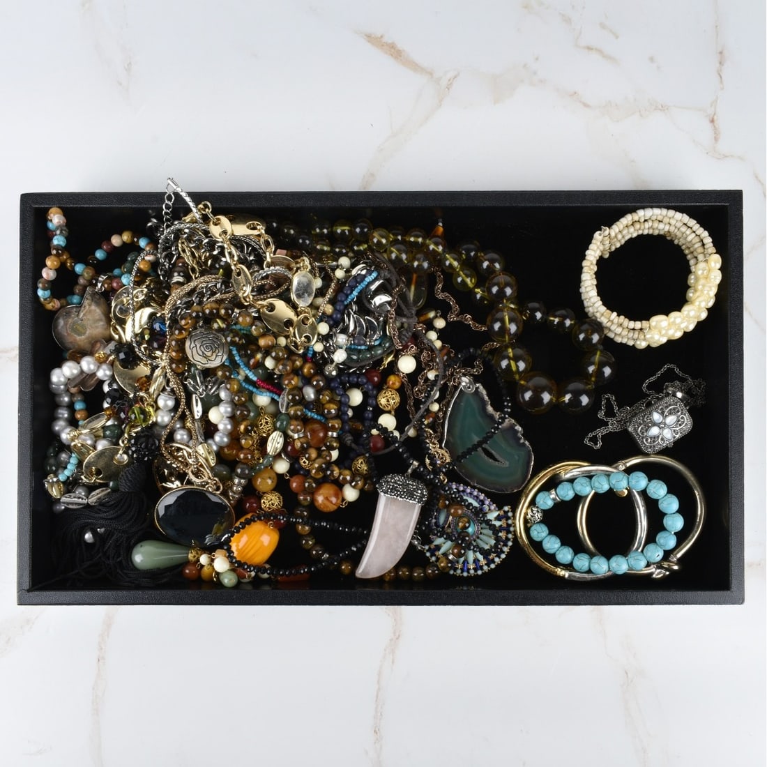 Box Lot of Fashion Jewelry: Box Lot of Fashion Jewelry. Large assortment of bracelets, necklaces, watches, earrings, watches and brooches. Condition: Good condition. Estimate: $40.00 - $80.00 Domestic Shipping: $40.00