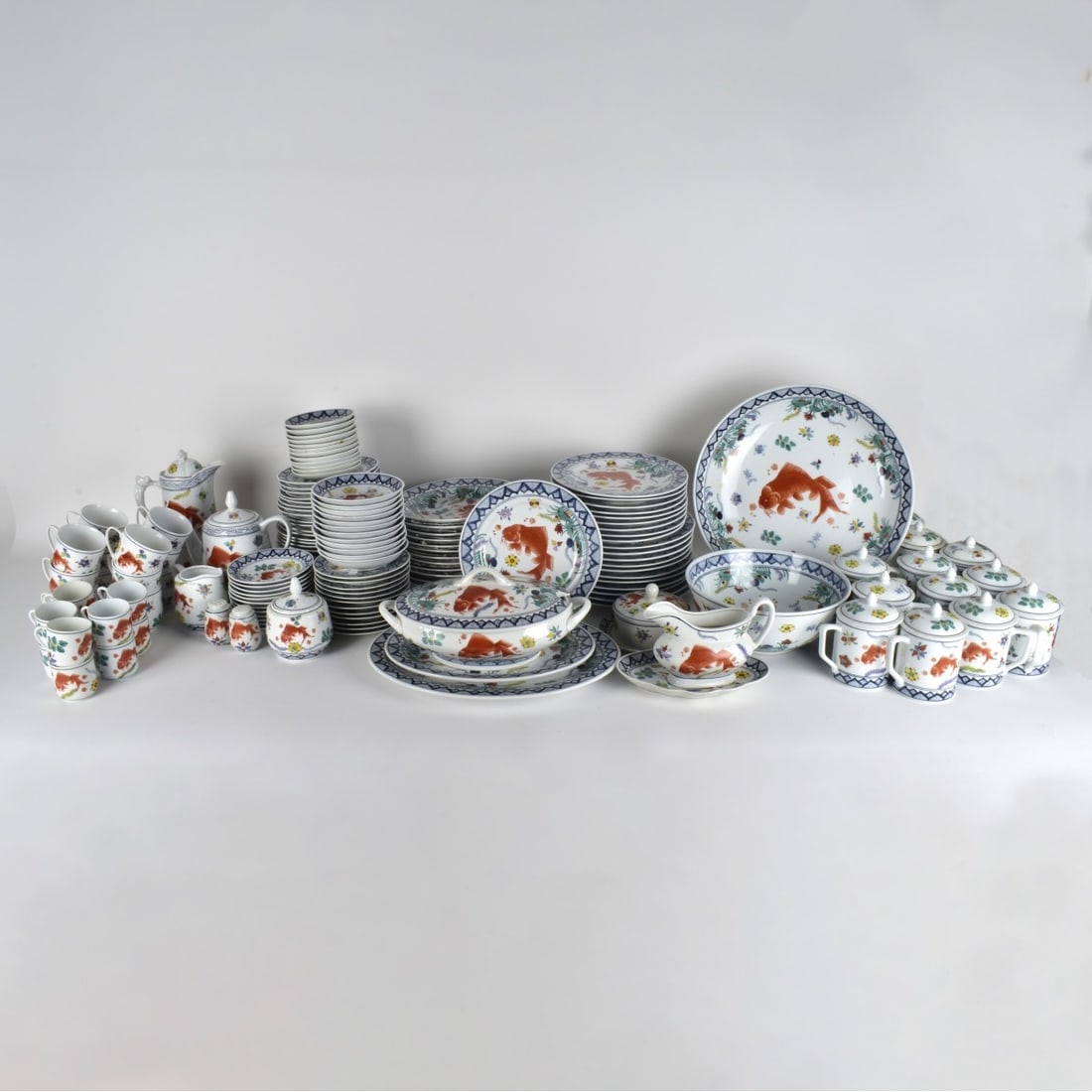 Yuet Tung China Service: 127 Pieces of Yuet Tung China Service Hand Painted Koi and foliage on Porcelain . Lot includes: Eleven (11) plates measuring:10", ten(10) plates measuring; (9"). twelve (12) plates measuring; 8", Twel