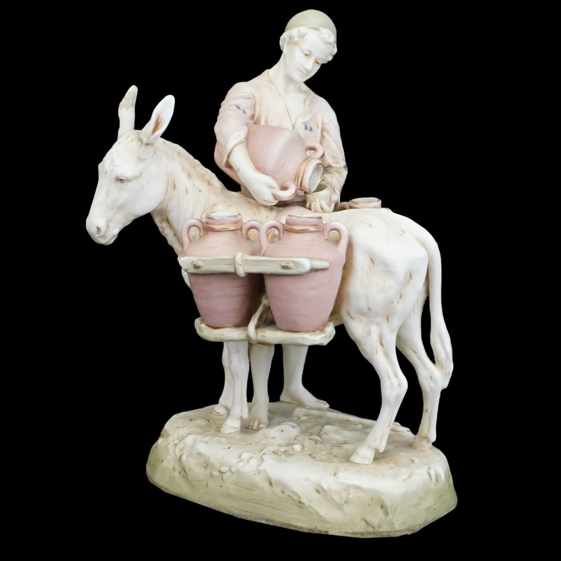 Amphora Porcelain Figurine: Large Amphora Porcelain Figurine of a Water Carrier Man with Donkey/Horse. Unsigned but numbered on the base. Measures 16-3/8" x 11" x 8-1/2". Condition: Repairs to the eras otherwise good condition.