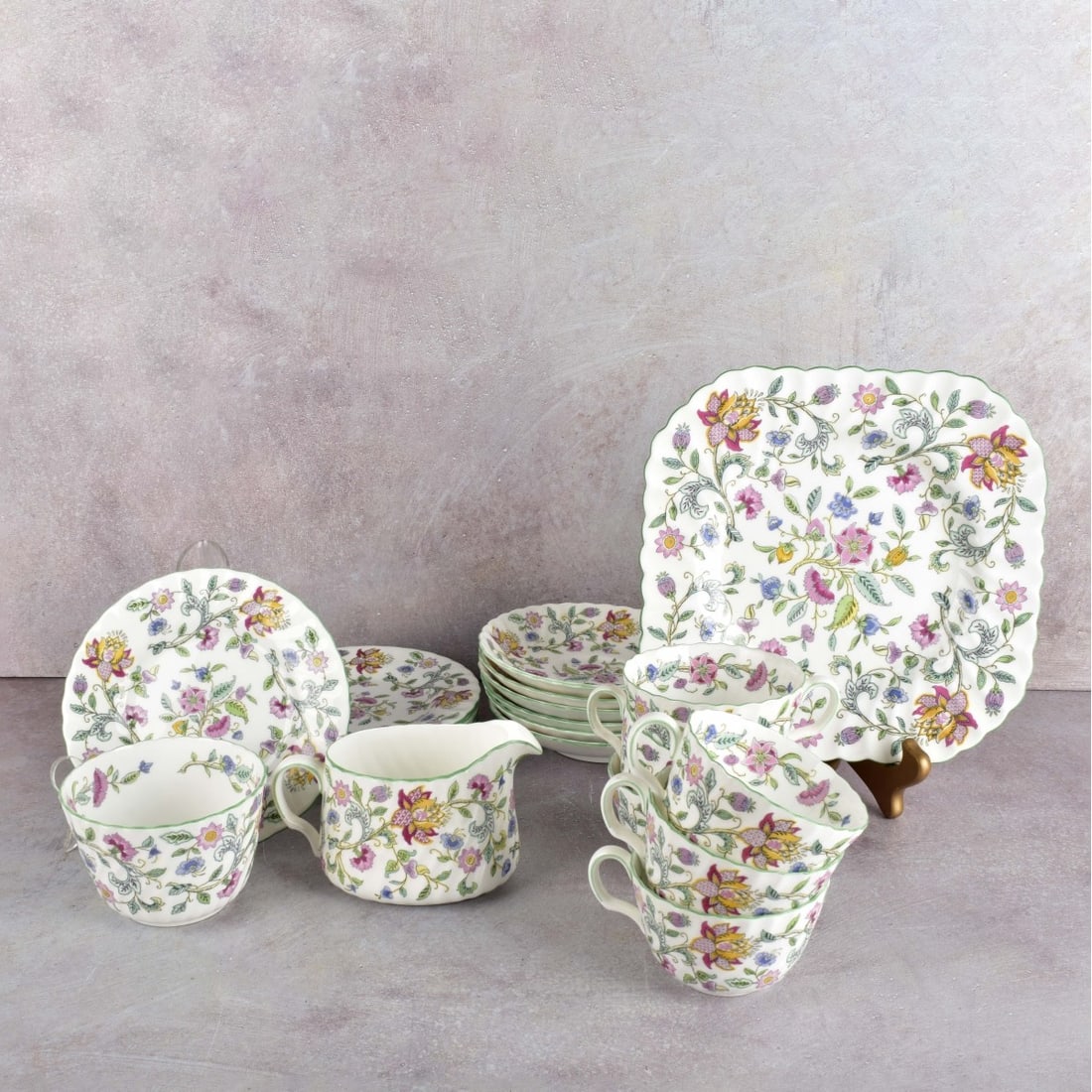 Minton "Haddon Hall" English Bone China: Twenty-one (21) Pieces Minton "Haddon Hall" English Bone China. Consisting of one (1) cake plate, measures: 8-5/8" Sq., six (6) small plates, measures: 6-1/4" Dia., six (6 cups and 6 saucers, one open