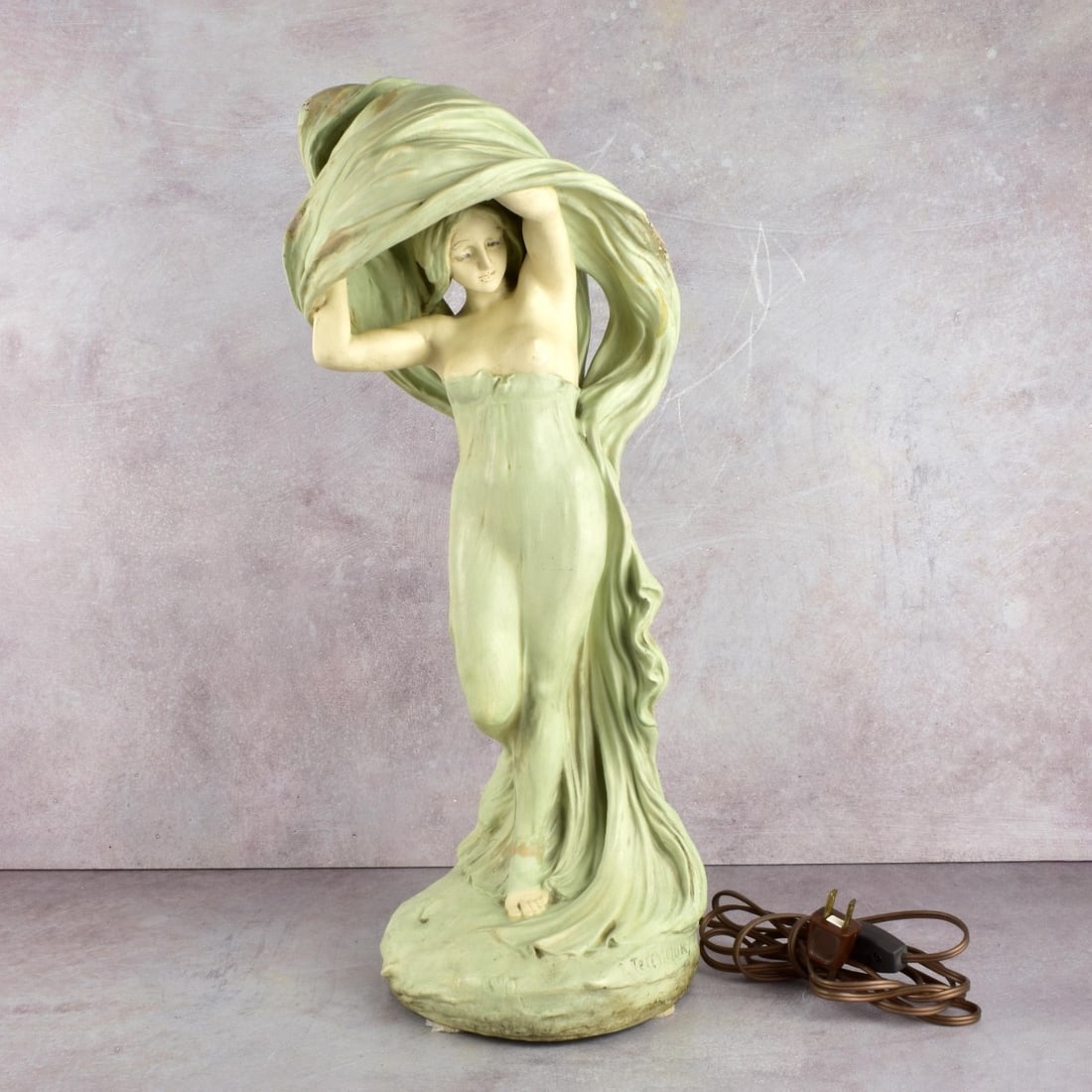 Art Nouveau Lamp after Peter Tereszuk (1875-1963): Art Nouveau Lamp after Peter Tereszcuk Austrian (1875-1963). Painted ceramic with flowing robes. It measures; 21" H, 8" W". Original wiring.. Kodner Galleries offers phone and absentee bidding at a lo