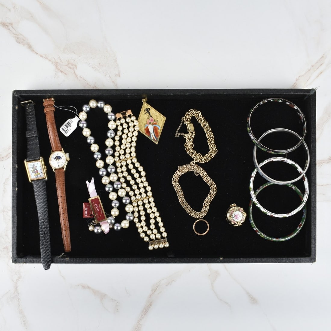 Fashion Jewelry: Tray Lot of Fashion Jewelry and Watches. To include a Majorica 10mm pearl necklace, a four stand pearl and sterling silver bracelet, two gold filled link bracelets, four bangle bracelets, one ring, on