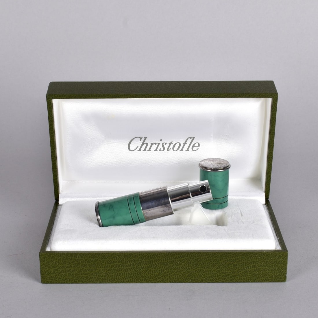 Christofle Atomizer: Christofle Silver Plate and Laque de Chine Atomizer. Original Box. Signed Christofle, France, Laque de Chine. Good Condition. Measures: 3" L. Kodner Galleries offers phone and absentee bidding at a lo