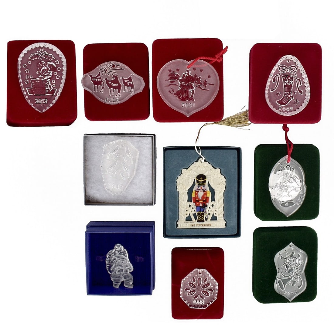 11 Christmas Ornaments mostly Waterford: Eleven (11) Christmas Ornaments mostly Waterford, in Boxes, 1897, 1988, 1989, 2000, 2001, 2002, 2003, 2009, and 2012. A Lenox Porcelain 1992 in fitted box and one a Santa in a Swarvoski box but not ma