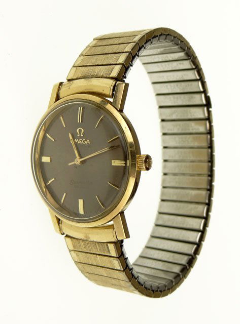 Mid 20th Century 14 Karat Goldfilled Omega Seamast: Mid 20th Century 14 Karat Goldfilled Omega Seamaster Deville Automatic Man's Wristwatch. Dial Signed Omega, Automatic, Seamaster and Deville. Rear of Case Signed 14 Karat Gold Filled. Band Signed Spei