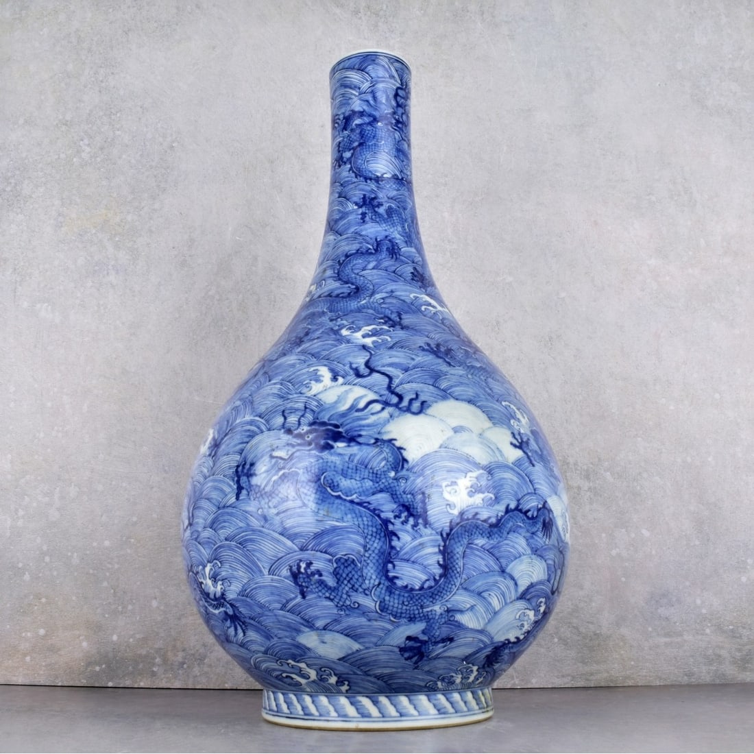 Chinese Blue and White Porcelain Bottle Vase: Chinese Blue and White Porcelain Bottle Vase. Decorated with five (5) claw dragons all around. Bears the Yongzheng mark under glaze to the bottom. Measures: 15-1/2" H., 8" Dia. Kodner Galleries offers