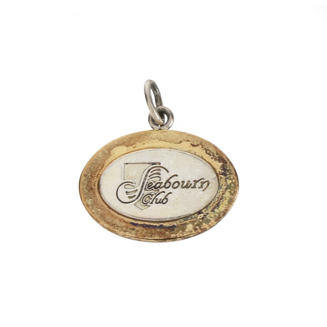 Tiffany & Co Pendant: Vintage Tiffany & Co 18 Karat Yellow Gold on Sterling Silver "Seabourn Club" Pendant. Signed, stamped 18K on Sterling. Measures 7/8" L, 7/8" W. Approx. weight: 4.63 grams. Condition: Good vintage cond