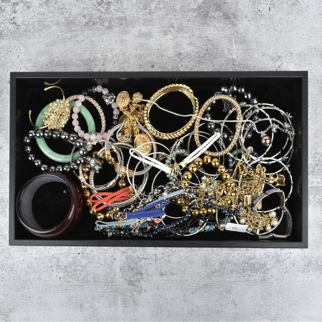 Collection of Fashion Bracelets: Collection of Fashion Bracelets. Variously accented hardstones, faux pearls, faux gemstones and more. Various styles and makers. Condition: Good condition. Some new with tags. Estimate: $50.00 - $150.