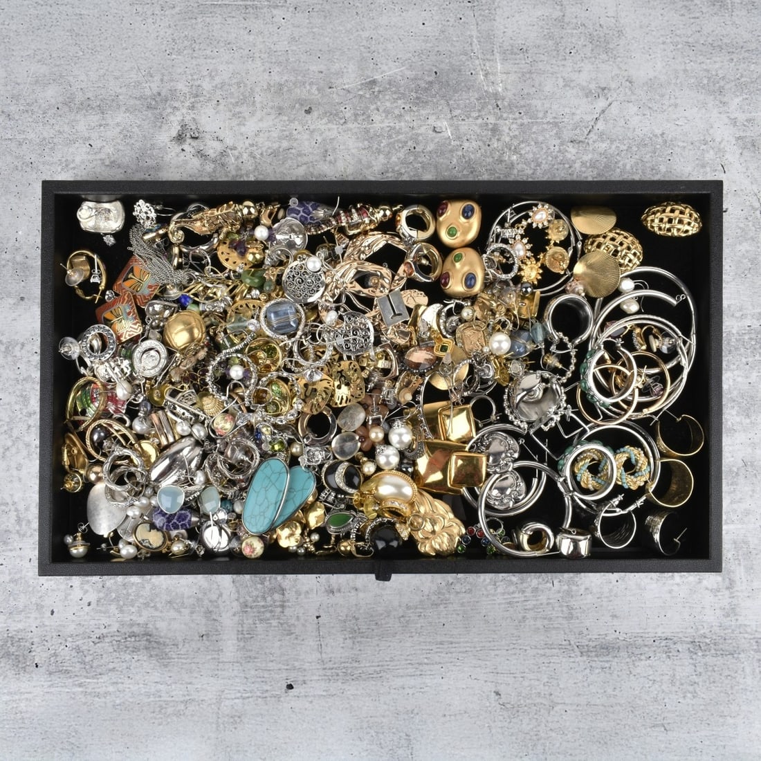 Collection of Fashion Earrings: Large Collection of Fashion Earrings and Ear Studs. Variously accented with hardstones, enamel, faux pearls, faux gemstones and more. Various styles and makers. Some are singles. Condition: Good vinta