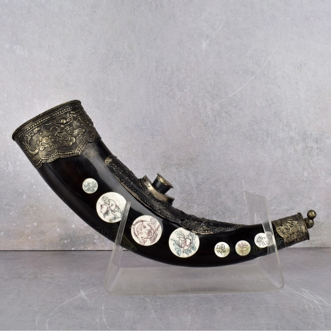 Vintage Chinese Opium Pipe Horn: Vintage Chinese Opium Pipe Horn with Silver Mounts with Circular Polychrome Bone Inlays. Stand is for display purposes only. Pipe curvature measures: 14-1/2" L., 3" W., 2-1/8" D. Kodner Galleries offe