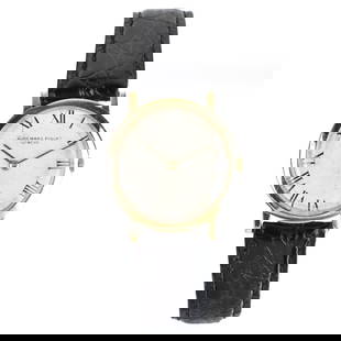 Audemars Piguet 18K Watch: Man's Vintage Audemars Piguet 18 Karat Yellow Gold Watch. White dial, Roman numerals. Manual wind movement. Leather strap bracelet. Case measures 30mm. Approx. gross weight: 24.28 grams. Kodner Galler