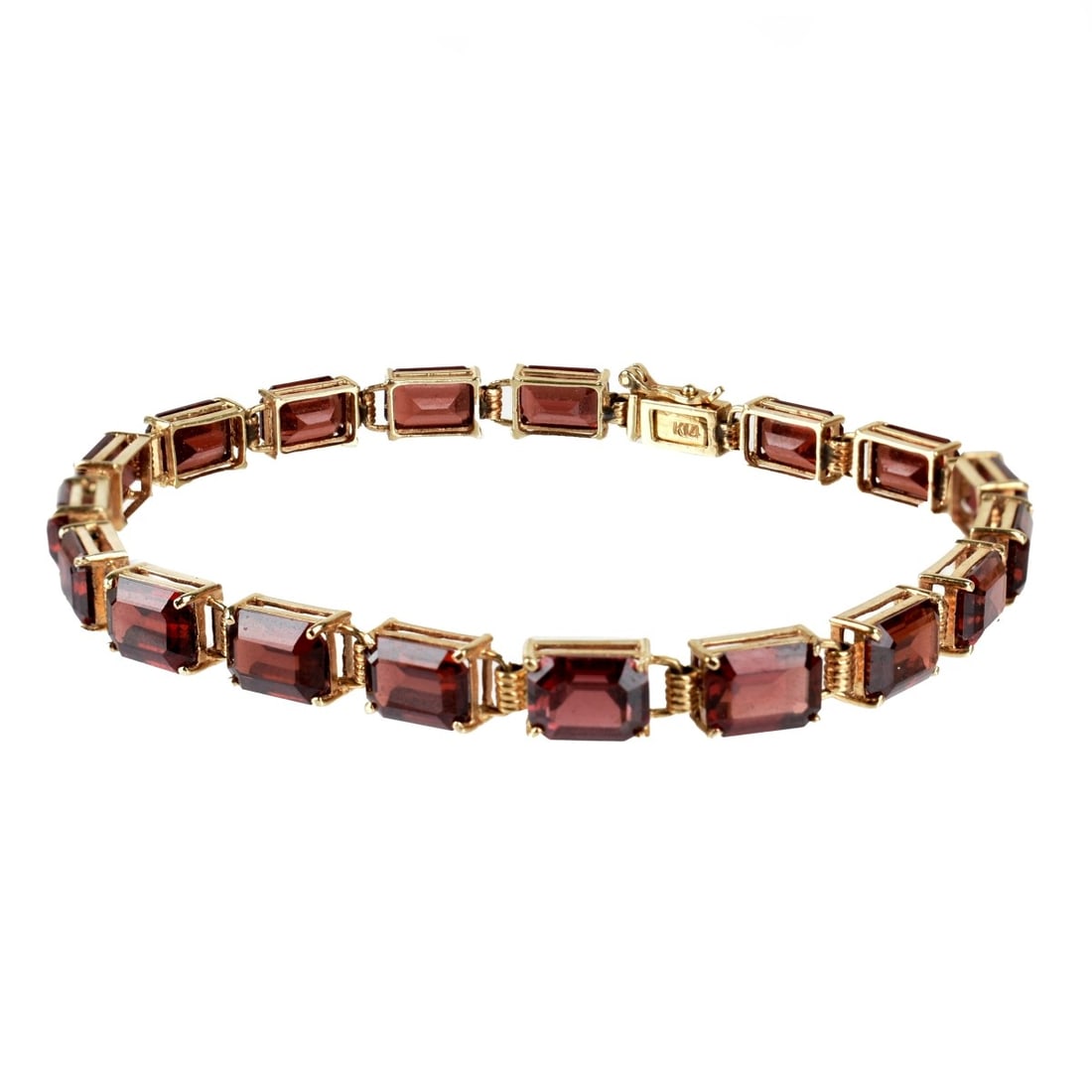 Garnet and 14K Bracelet: Vintage Eighteen Emerald Cut Garnet and 14 Karat Yellow Gold Bracelet. Garnets with good color and clarity. Clasp stamped 14K. Measures 7" L. Approx. weight: 10.24 grams. Kodner Galleries offers phone