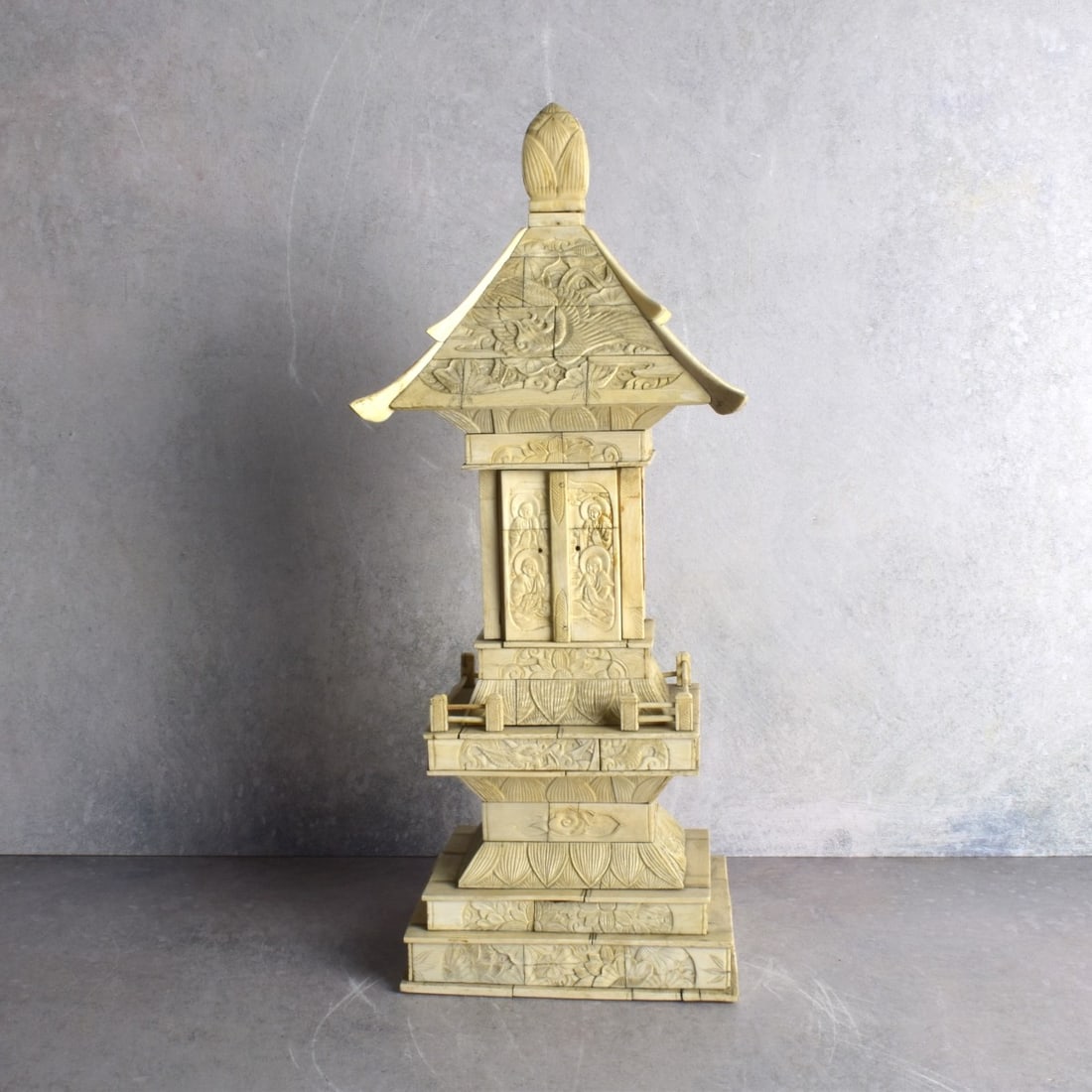 Antique Religious Chinese Carved Bone Pagoda: Antique Religious Chinese Carved Bone Pagoda Sculpture. Measures: 15-1/2" H., 6-1/2" W., 5-1/2" D. Kodner Galleries offers phone and absentee bidding at a low, flat 21% buyer’s premium without surch