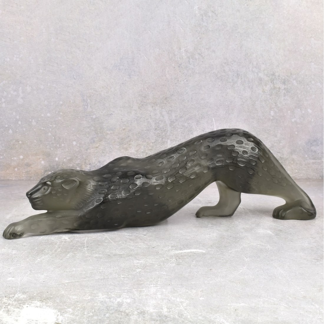 Lalique Crystal Zeila Panther: Lalique Crystal Zeila Panther in Black Glass. Signed Lalique France to the bottom of a front paw. Measures: 4-1/4" H, 14-1/2" L, 2-1/2" W. Kodner Galleries offers phone and absentee bidding at a low,