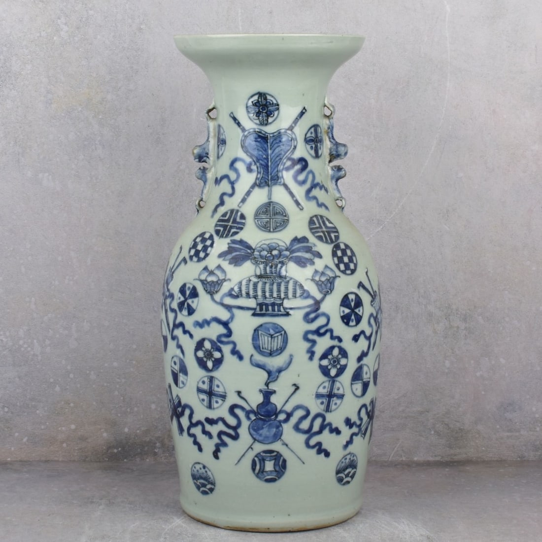 Chinese Blue and White Porcelain Vase.: Chinese Blue and White Hand Painted Porcelain Vase. Late 20th century. Decorated with auspicious designs and attached Foo dog handles. Measures: 17-1/4" H, top diameter measures: 6-3/4" Dia., bottom d