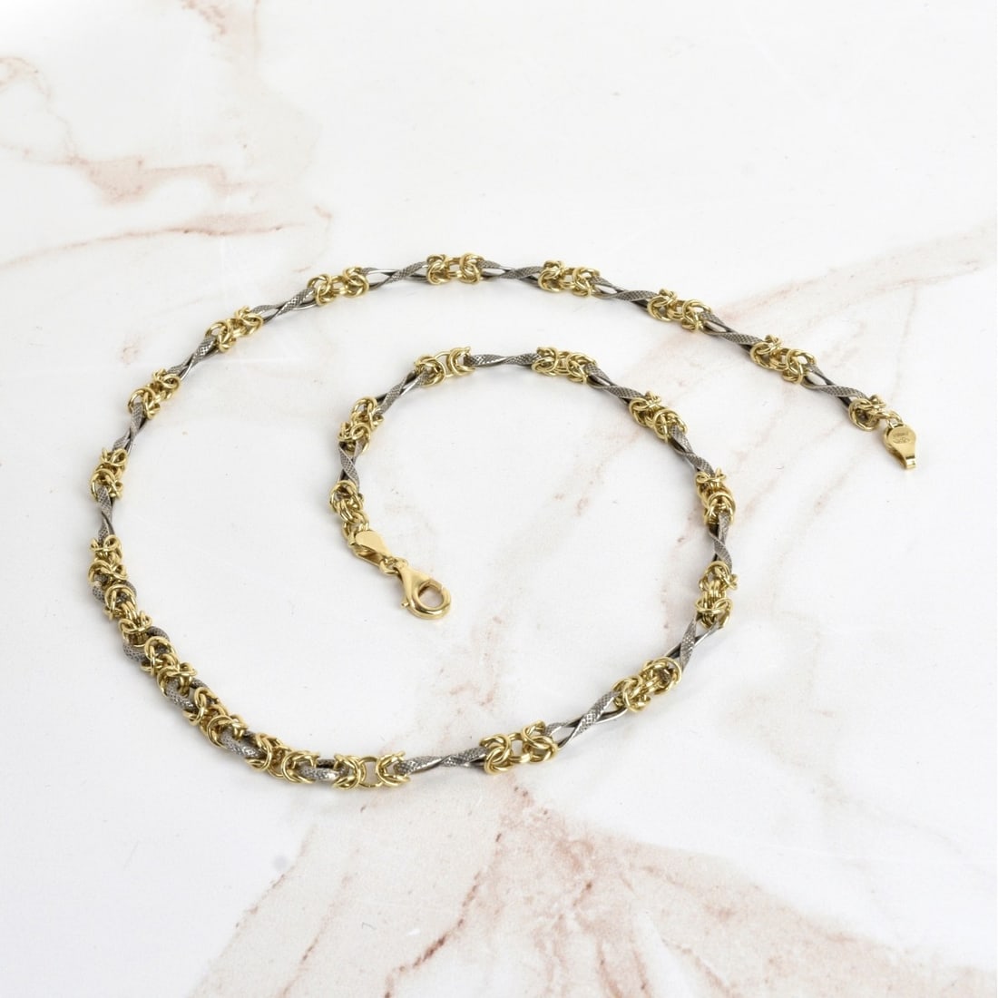 Platinum and 18K Necklace: Fine Italian Handmade Platinum and 18 Karat Yellow Gold Link Necklace. Stamped Italy 950, 750. Measures 18" L. Approx. weight: 10.59 grams. Kodner Galleries offers phone and absentee bidding at a low,