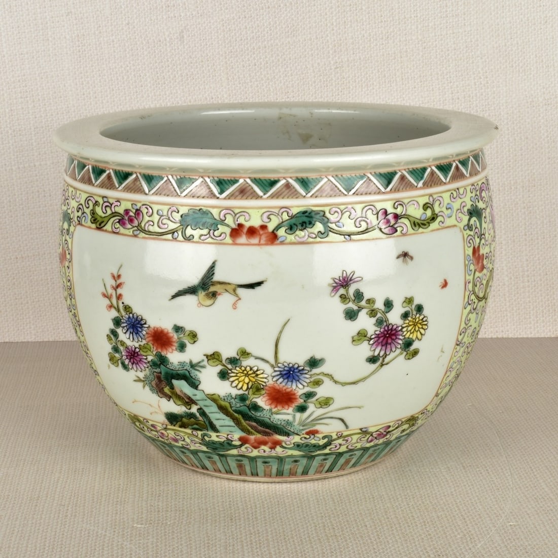 Chinese Famille Rose Jardiniere: Antique Chinese Famille Rose Floral Decorated Jardiniere. Artist signed with six character chop marks to the bottom. Mid 20th century. Measures: 7" H, 9" D. Kodner Galleries offers phone and absentee 