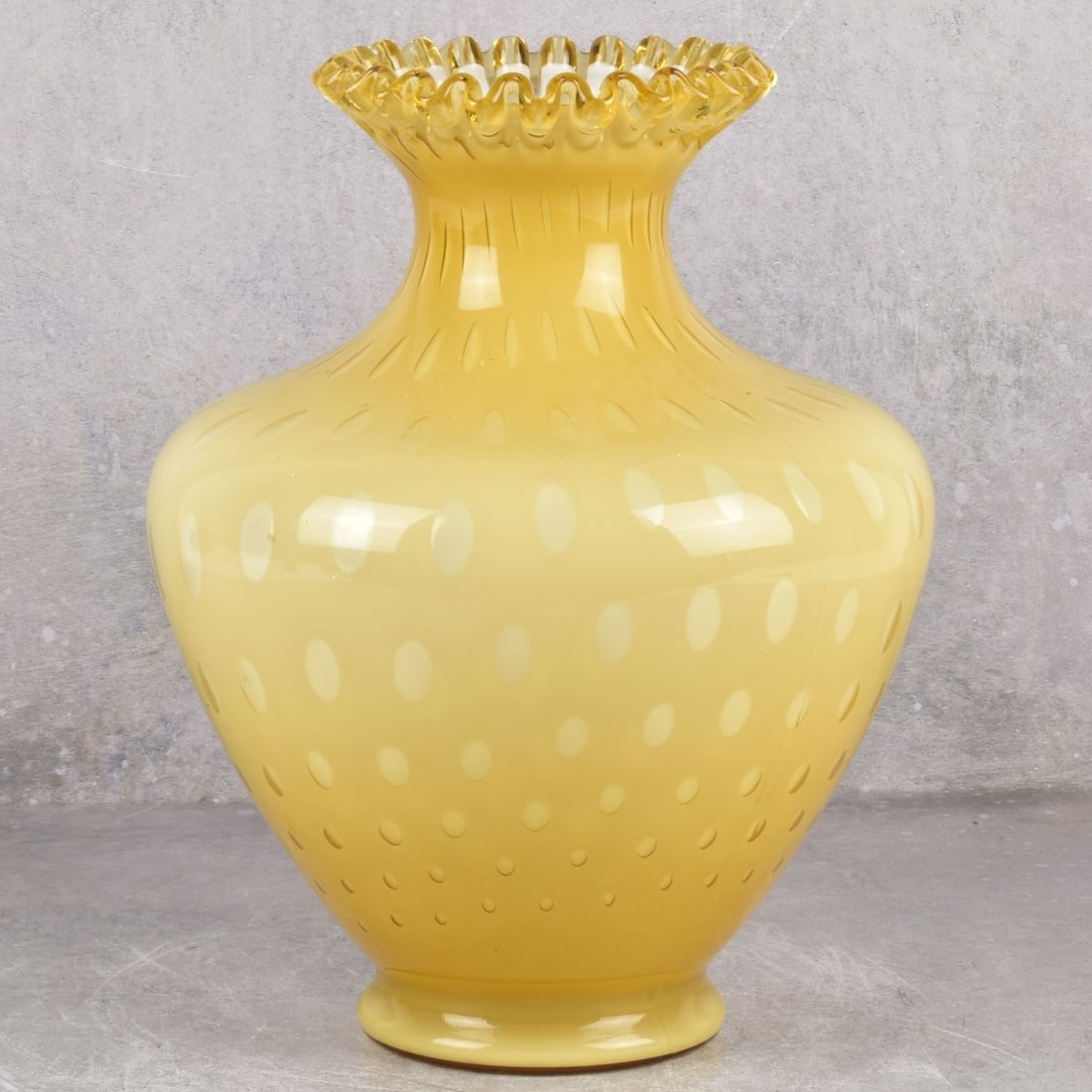 Fenton Art Glass Vase-Honey to Case White: Fenton Art Glass Honey-Amber Case White Glass Fluted Urn Style Glass Vase. Circa 1970. Marked to the bottom. Measures: 11-1/4" High, 8-1/4" Diameter. Kodner Galleries offers phone and absentee bidding