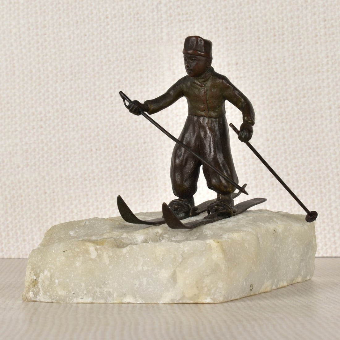 Vienna Bronze Skier: Vienna Bronze Figure of a Skier Mounted of a Rock with a Snow Covered Effect, Late 19th century. Figure measures: 2-3/4", base measures: 1" H, 4-1/2" L, 2-3/4" D. Kodner Galleries offers phone and abs