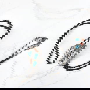 Zuni Turquoise, Coral and Silver Bolo Tie: Vintage Effie Calavaza Zuni Turquoise, Red Coral and Silver Bolo Tie with Braided Leather. Signed, stamped Zuni. Slider measures 2-3/8" H, 1-5/8" W; tie measures 38" L. Approx. weight: 68.87 grams.