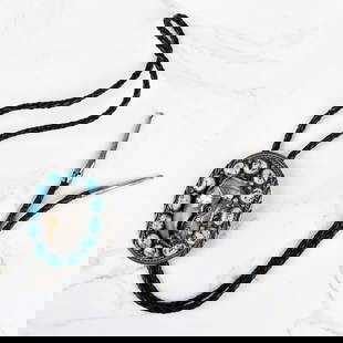 Navajo Turquoise, Bear Claw and Silver Bolo Tie: Vintage Navajo Turquoise, Bear Claw and Silver Bolo Tie with Braided Leather. Slider measures 2-7/8" H, 2-1/4" W; tie measures 38" L. Approx. gross weight: 73.68 grams. Kodner Galleries offers phone