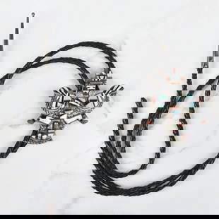 Zuni Hardstone and Silver Bolo Tie: Vintage H & Esther Cellicion Zuni Turquoise, Red Coral, Black Onyx and Mother of Pearl Inlaid Silver Bolo Tie with Braided Leather. Stamped Zuni, signed. Slider measures 2-1/2" H, 2" W. Tie measures