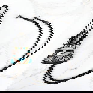 Navajo Hardstone and Silver Bolo Tie: Vintage Mary Livingston Navajo Turquoise, Red Coral, Black Onyx and Mother of Pearl Inlaid Silver Bolo Tie with Braided Leather. Signed. Slider measures 3-1/2" H, 2-5/8" W. Tie measures 44" L.