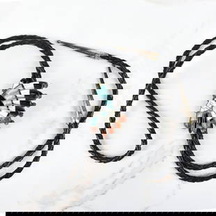 Native American Hardstone & Silver Bolo Tie: Vintage Native American Turquoise, Black Onyx, Red Coral and Mother of Pearl Inlaid Silver Chief's Head Bolo Tie with Braided Leather. Slider measures 2" H, 1-1/2" W. tie measures 36" L. Approx.