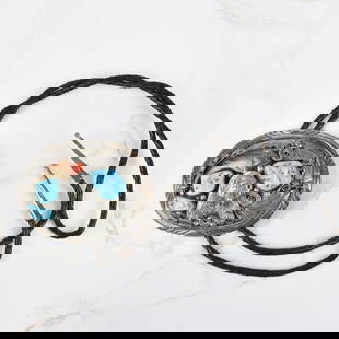 Navajo Hardstone and Silver Bolo Tie: Vintage Navajo Turquoise, Red Coral and Bear Claw Inlaid Silver Bolo Tie. Slider measures 2-5/8" H, 3-1/2" W tie measures 38" L. Approx. gross weight: 107.56 grams. Kodner Galleries offers phone and