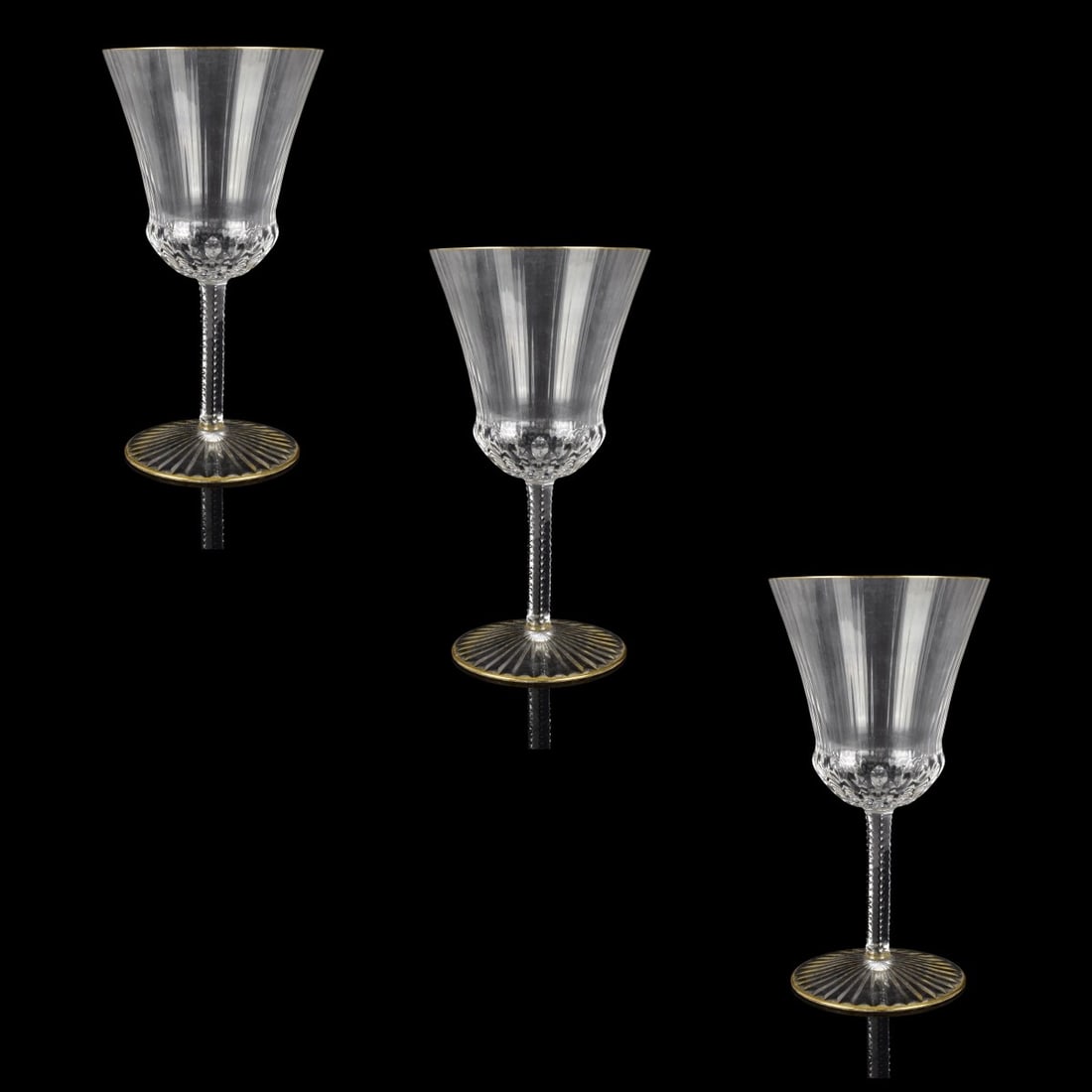 St Louis "Apollo" Wine Stems: Three French St Louis "Apollo" Pattern Crystal Red Wine Stems. Etched mark to base. Measure 7" H, 3-5/8" W (at rim). Kodner Galleries offers phone and absentee bidding at a low, flat 21% buyer’s pre