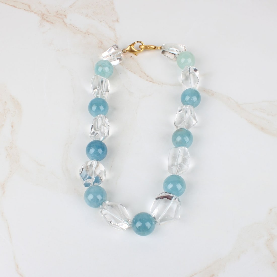 Quartz and Crystal Necklace: Vintage Large Blue Quartz and Crystal Bead Necklace with Gold Tone Metal Clasp. Quartz beads measure 18mm. Necklace measures 18" L. Provenance: former South Florida jewelry designer / maker. Kodner Ga