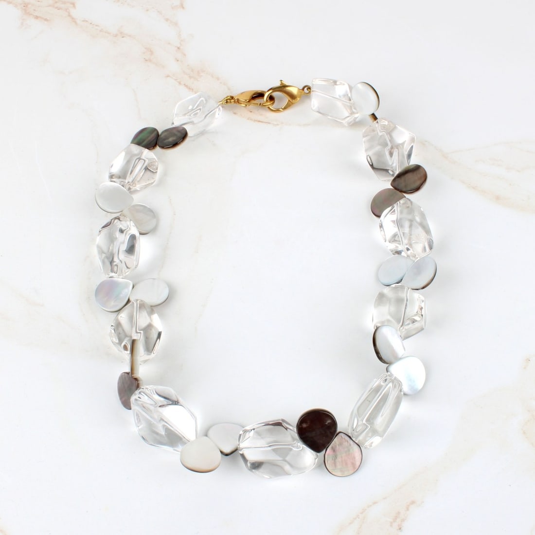 Crystal and MOP Necklace: Vintage Crystal and Mother of Pearl Bead Necklace with Gold Tone Metal Clasp. Crystal beads measure approx. 25.5 x 27.5mm. Necklace measures 18-1/2" L. Provenance: former South Florida jewelry designe