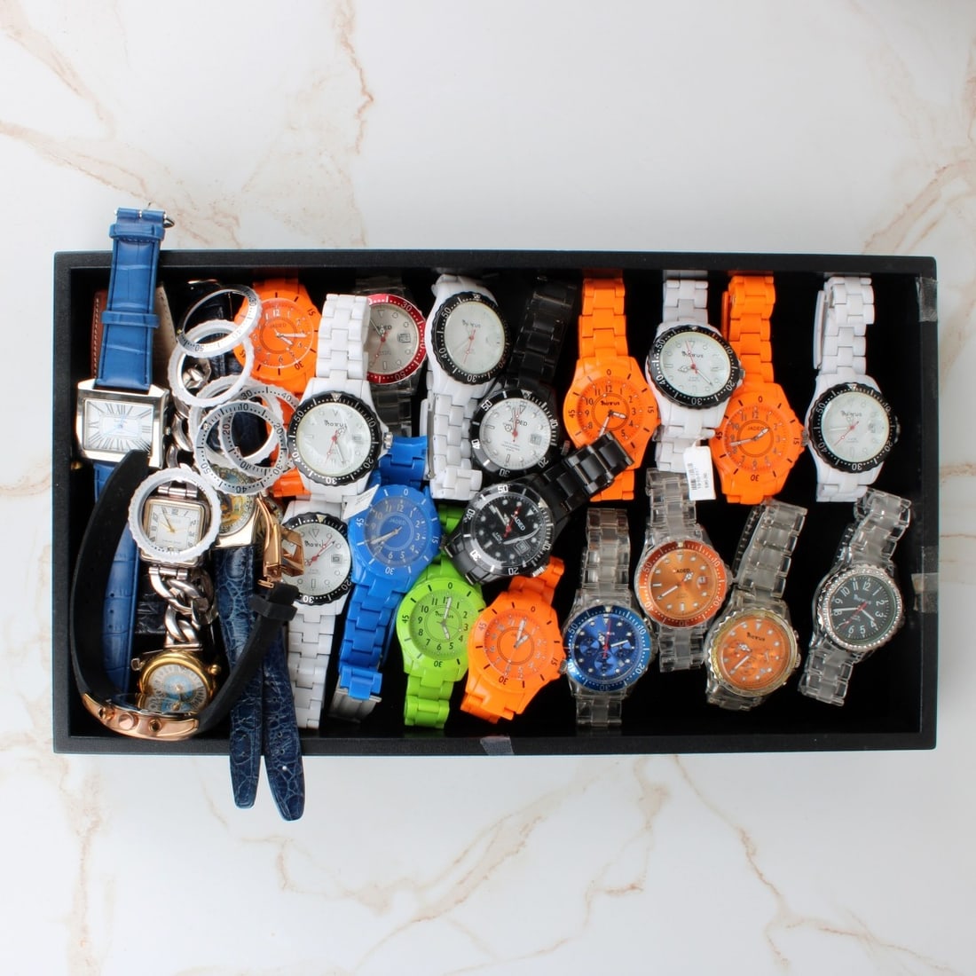 Tray Lot of Fashion Watches: Tray Lot of Quartz Fashion Watches. Various brands including Jaded. To include watches, watch straps and bezels. Provenance: former South Florida jewelry designer / maker. Kodner Galleries offers phon