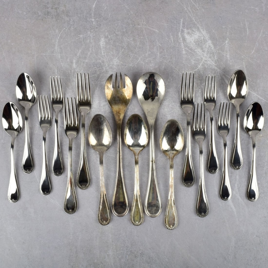 Christofle Table Wear Pieces: Christofle "Malmaison" Table Wear Pieces. Consisting of 8 stainless steel forks, measures: 7" long, 4 stainless steel tea spoons, measures: 7" long, 3 heavy silver plated place spoons, measures: 7-3/4