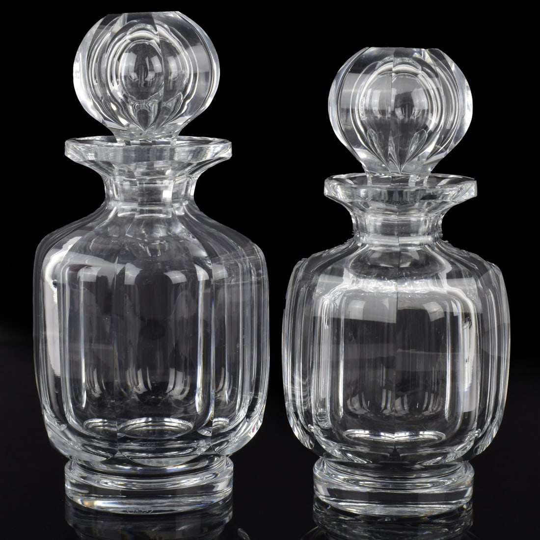 Baccarat French Cut Crystal Wine Decanters: Two (2) Vintage Baccarat French Cut Crystal Wine Decanters with Corresponding Stoppers. One (1) "Malmaison" decanter, properly marked to the bottom, measures: 8-1/2" high, 4" diameter, one (1) "Malmai