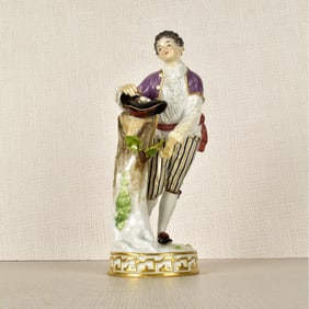 Meissen Figurine of a Boy Gathering Eggs