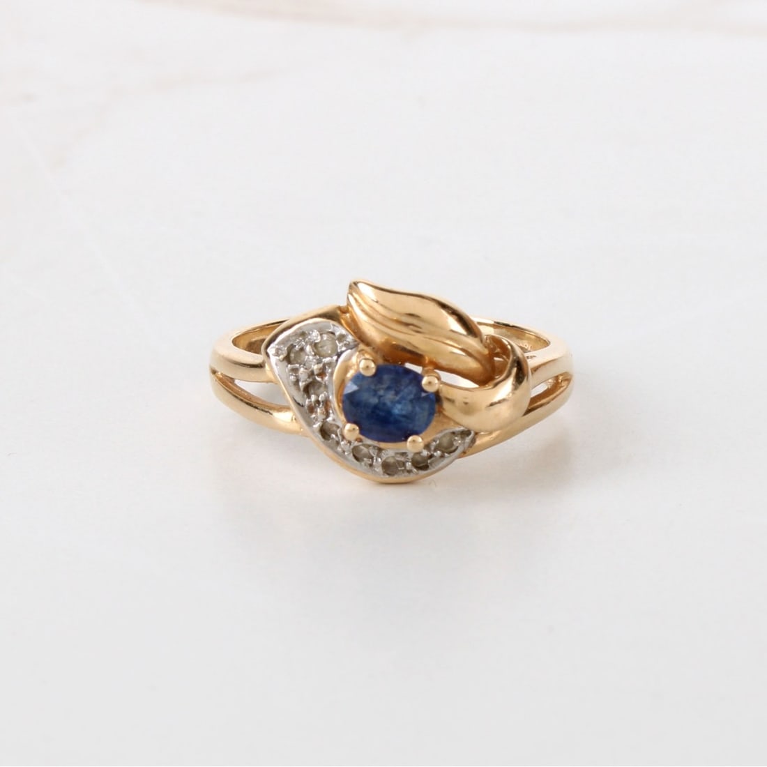 Sapphire, Diamond and 14K Ring: Vintage Oval Cut Sapphire and 14 Karat Yellow Gold Ring Accented with Small Round Cut Diamonds. Stamped 585. Ring size 6-1/2. Approx. weight: 3.32 grams. Condition: Good vintage condition. Needs clean