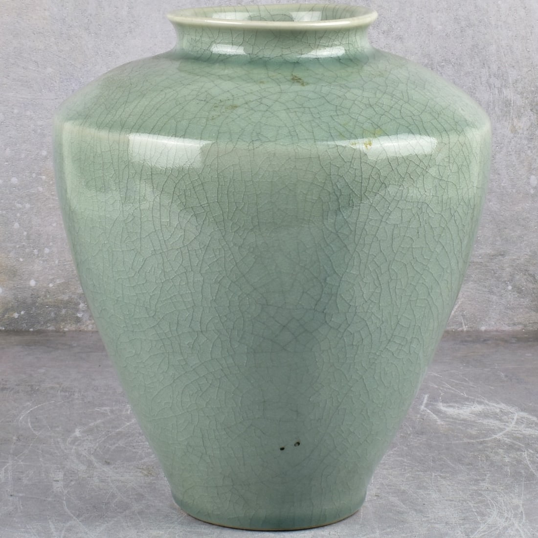 Chinese Celadon Crackle Glaze Vase: Chinese Celadon Crackle Glaze Vase. Measures: 9-1/2" high, 8" wide. Kodner Galleries offers phone and absentee bidding at a low, flat 21% buyer’s premium without surcharge or hidden fees. For inform