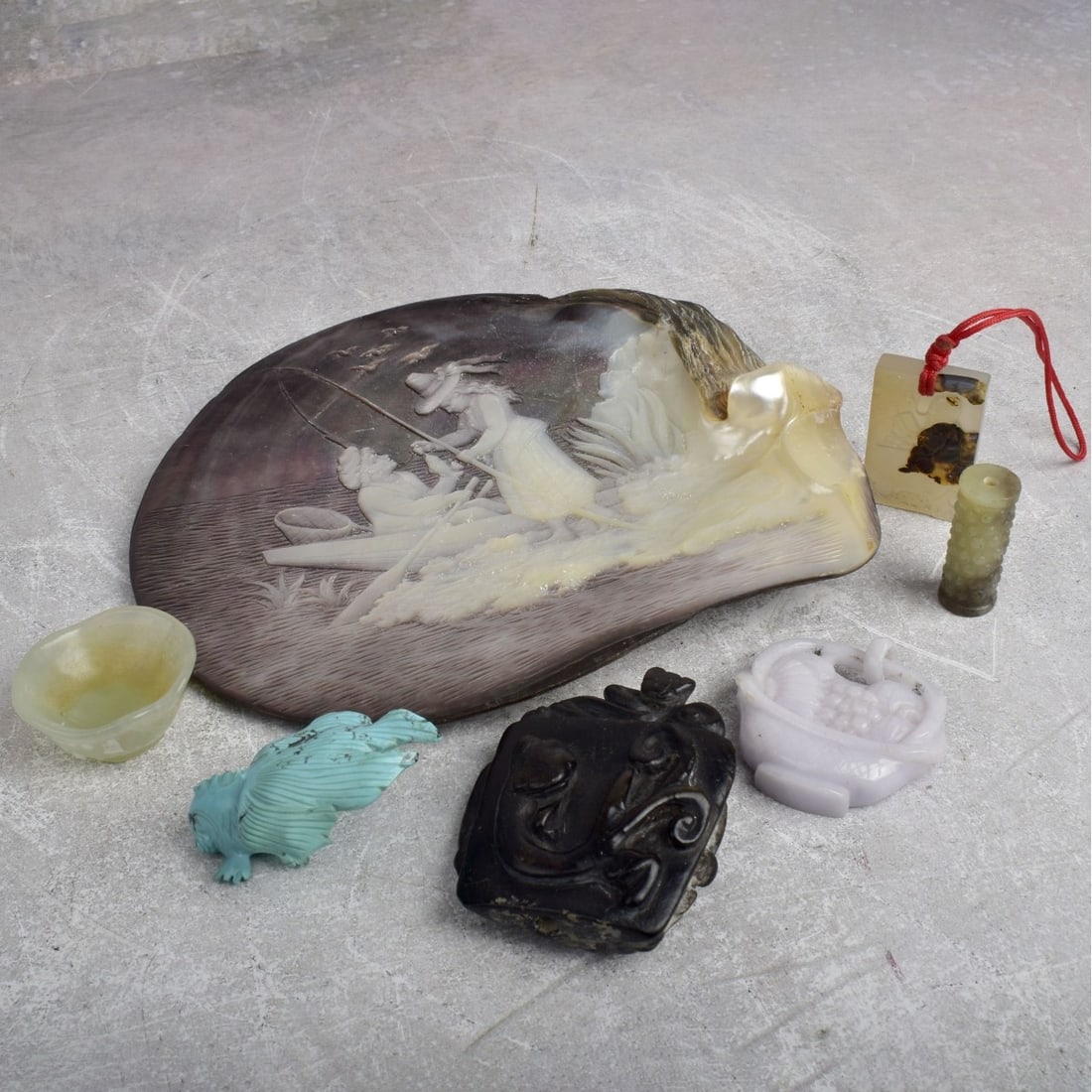 Natural Stone Pieces: Collection of Six (6) Natural Stone Pieces. Including one (1) turquoise carved fish, measures: 2-1/2" high, 1-3/4" wide, 1"deep, one (1) carved mother of pearl shell, measures: 6-5/8" high, 7-3/4"wide