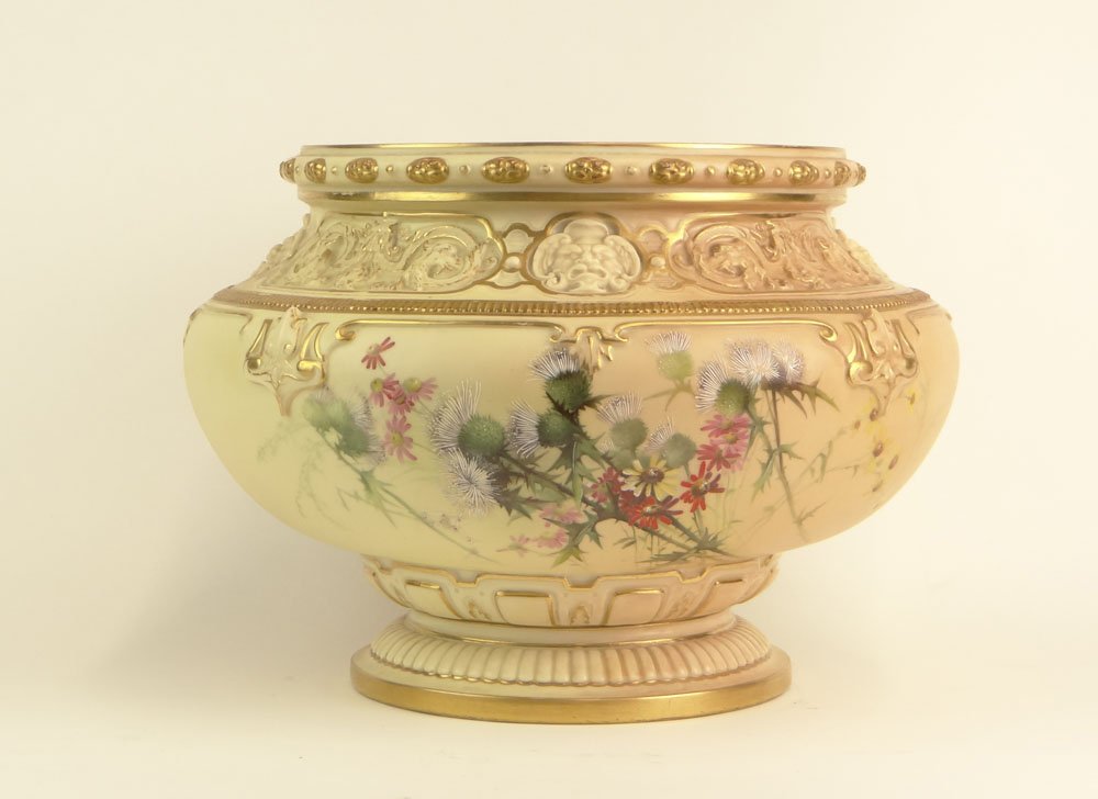 Early 20th Century Royal Worcester Large Blush Ivory Ur: Early 20th Century Royal Worcester Large Blush Ivory Urn Shape Vase with Thistle Decoration. Puce Mark (logo) to Base. Rubbing to Gilt Decoration otherwise Good Condition or Better. Measures 10 Inches
