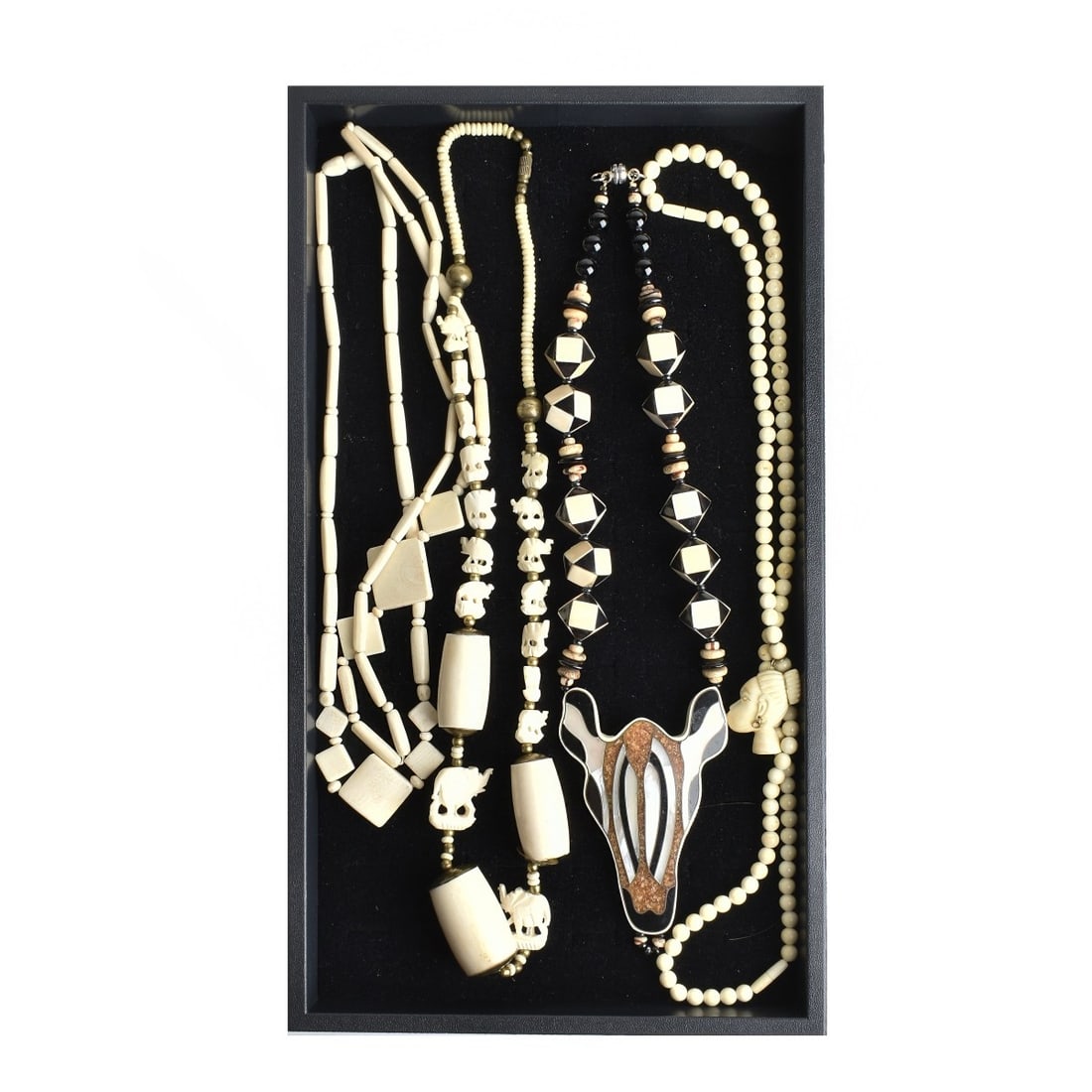 African Carved Beaded Necklaces: Lot of Five African Carved Beaded Necklaces. One is mother of pearl inlaid. Longest measures 32". We Will Not Ship This Item Out of State of Florida. Anyone Having This Item Shipped Must Have a Florid