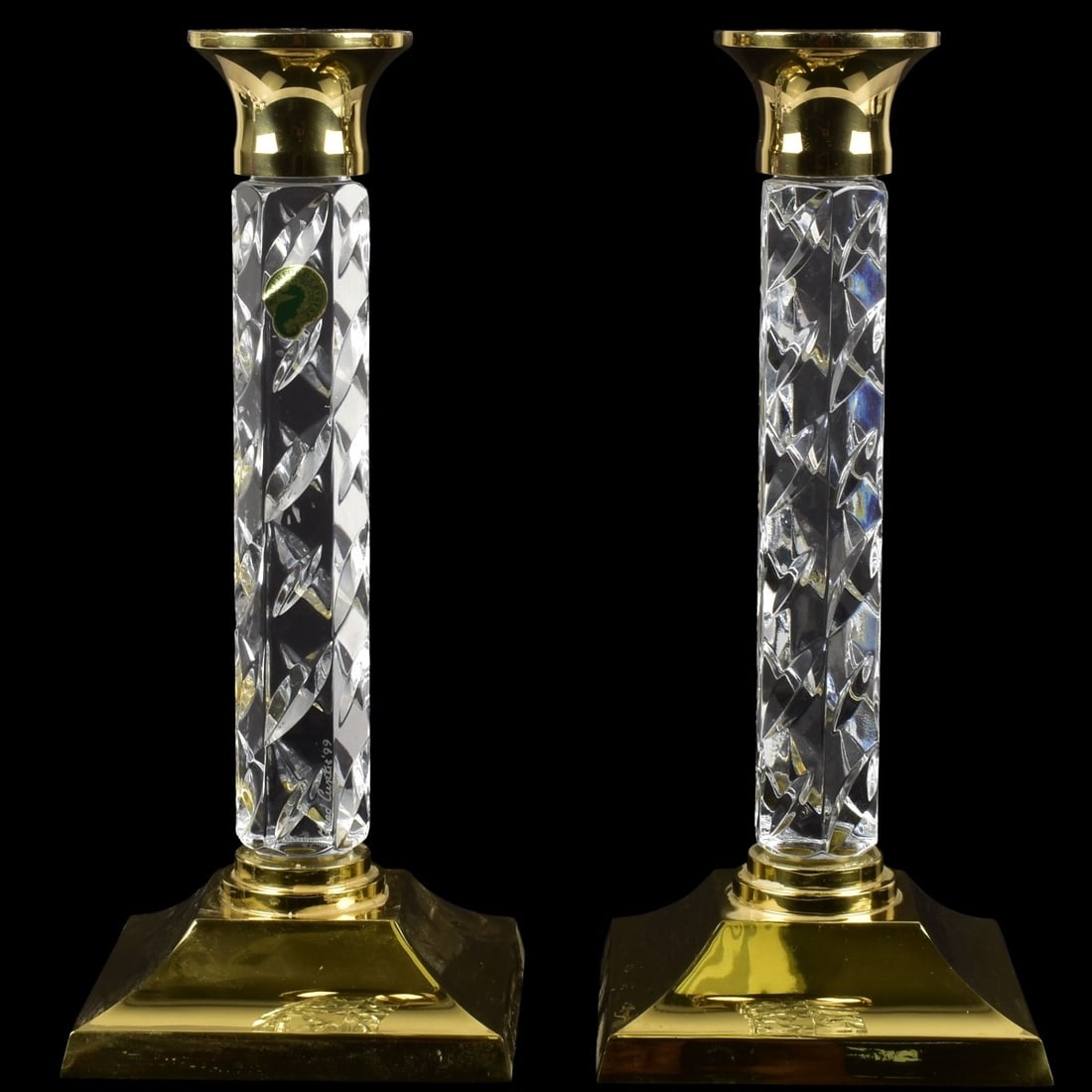 Waterford Crystal and Brass Candlesticks: Waterford Crystal and Polished Brass Candlesticks. Measures: 11" high, bases measure, 4-5/8" square. Kodner Galleries offers phone and absentee bidding at a low, flat 21% buyer’s premium without sur