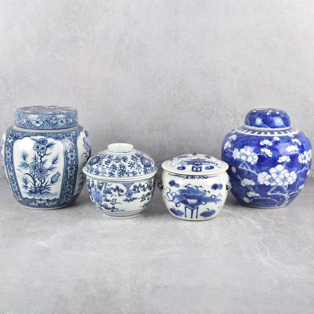 Vintage Chinese Blue and White Porcelain Jars: Four (4) Vintage Chinese Blue and White Porcelain Jars with Covers, one with Inner Flat Cover, Tallest measures: 8" high, 7" diameter. Kodner Galleries offers phone and absentee bidding at a low, flat