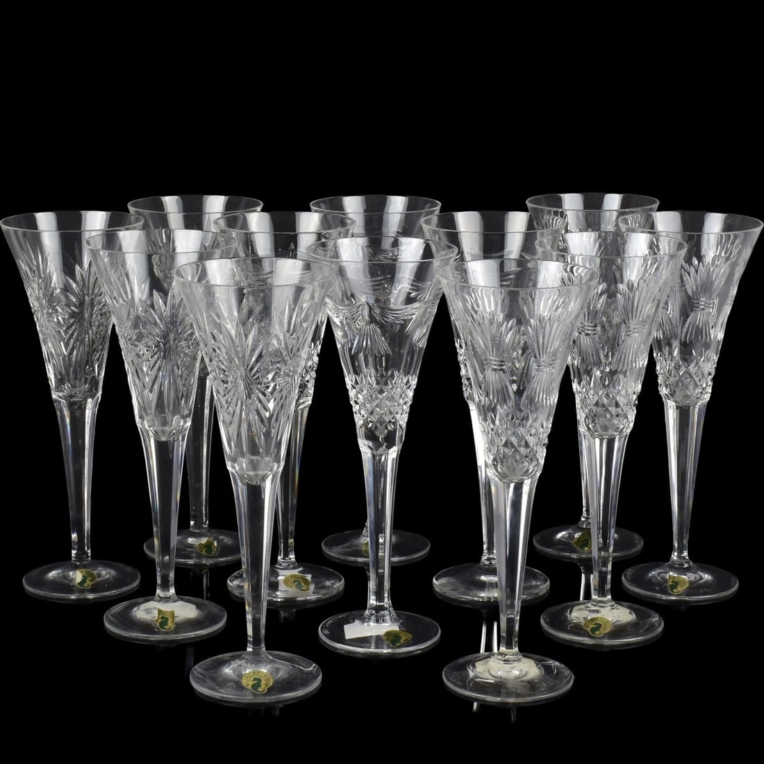 Waterford Cut Crystal Millenium Flutes: Twelve (12) Waterford Cut Crystal Millenium Champagne Toasting Flutes. Consisting of four (4) each of Prosperity, Peace and Health patterns. Each marked "Waterford" to the bottoms. Measures: 9-1/4" hi